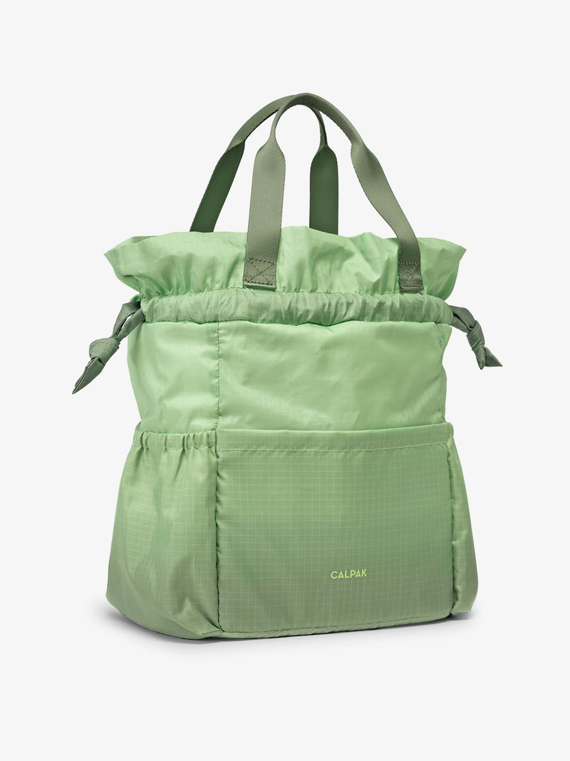 CALPAK Insulated Lunch Bag in ombre green Matcha side view open with handles