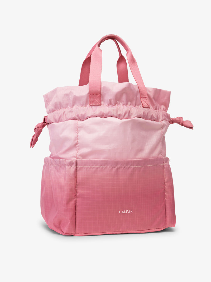 CALPAK Insulated Lunch Bag in ombre pink Tea Rose side view with handles and opened