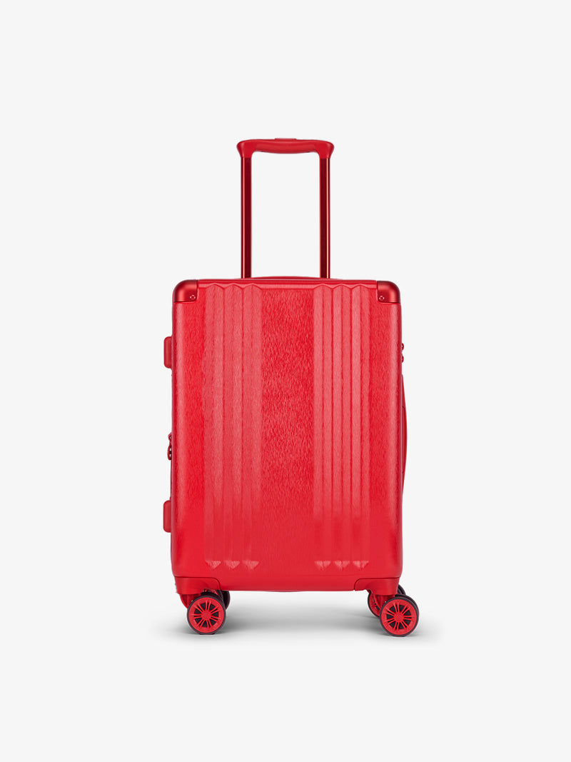 Metallic red CALPAK Ambeur hard shell rolling carry-on suitcase as part of the luggage set