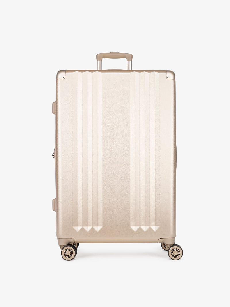 large gold suitcase as part of 3 piece suitcase set