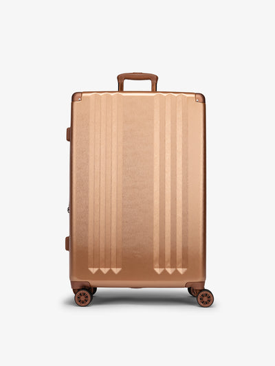 Studio product shot of front-facing CALPAK Ambeur large 30-inch hardshell luggage with 360 spinner wheels in copper; LAM1028-COPPER view 1