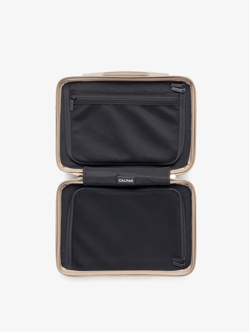 Top view of opened CALPAK gold travel vanity case