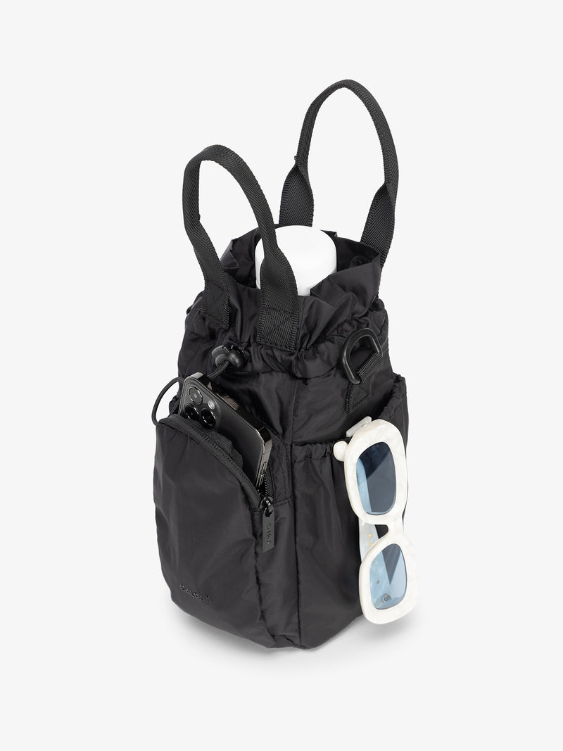 water bottle bag in black with phone and sunglasses