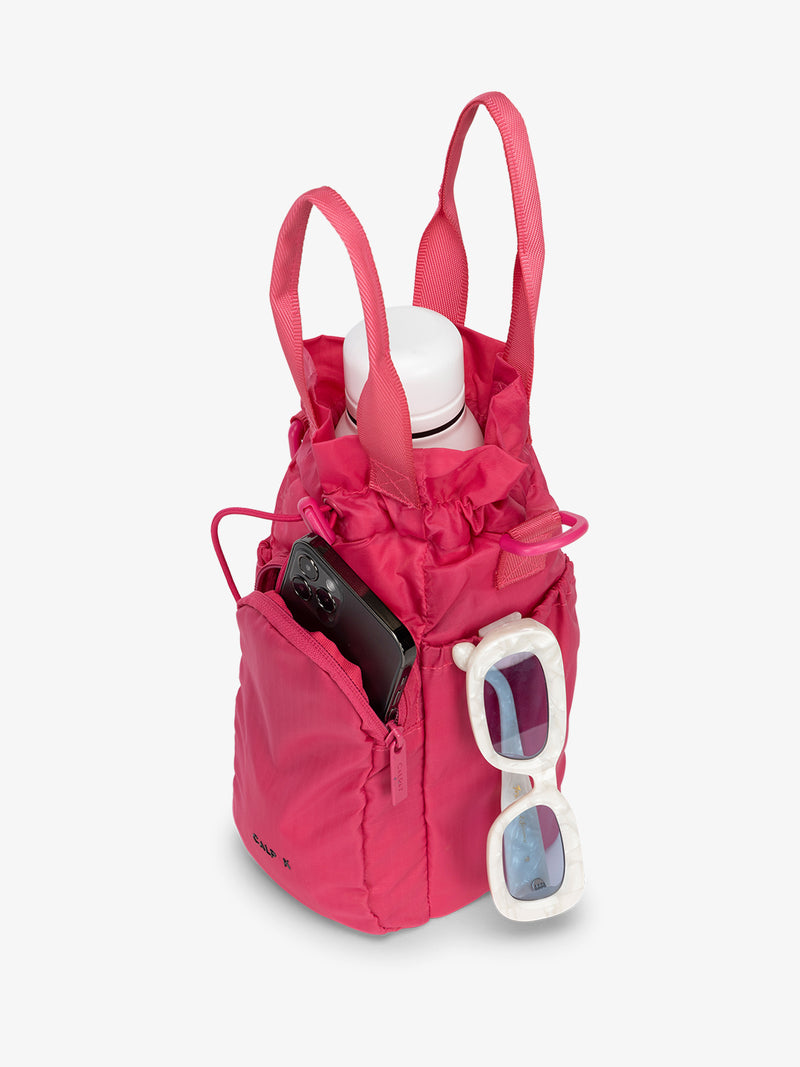 water bottle bag in fuscia pink with phone and sunglasses