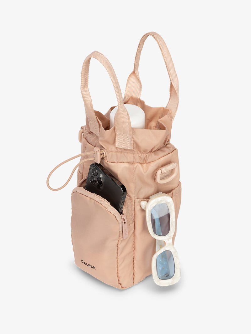 water bottle bag in light pink Mauve with phone and sunglasses