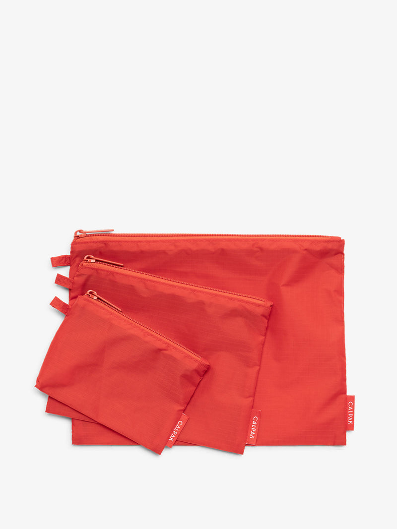 CALPAK Compakt zippered pouches in red