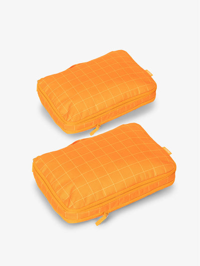 CALPAK compression packing cubes in orange grid; PCC2201-ORANGE-GRID view 1