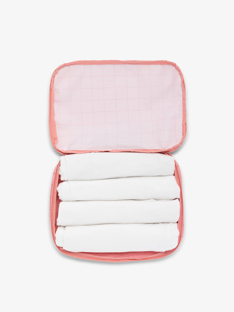 CALPAK packing cubes for travel in pink grid