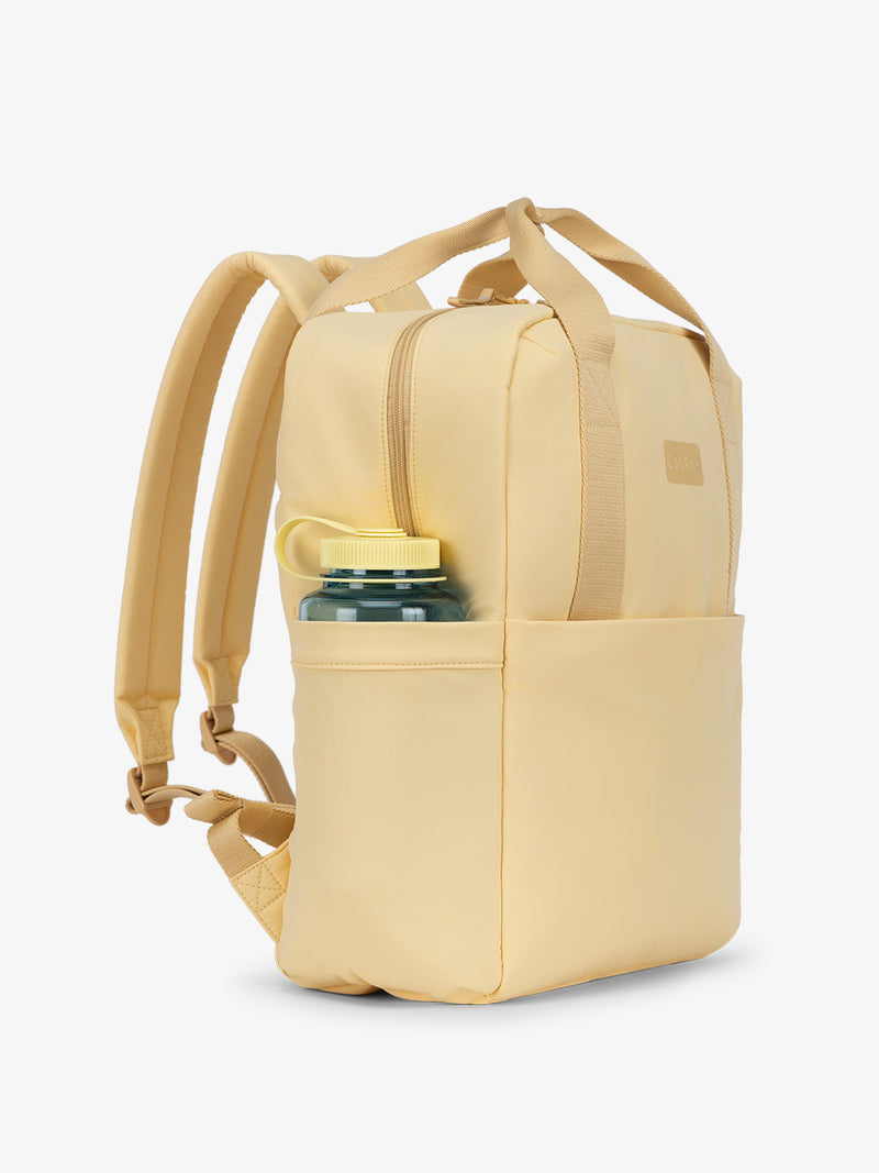 CALPAK Connect Laptop Backpack with large side water bottle pocket in sunshine yellow