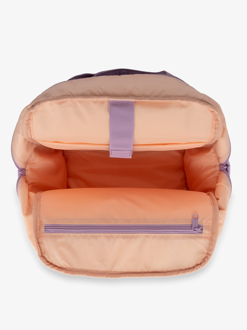 CALPAK Connect Laptop Backpack with multiple interior pockets and a padded laptop sleeve with purple exterior, orange interior