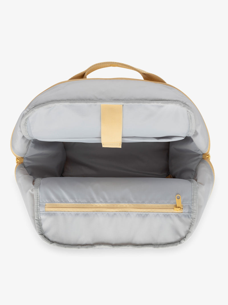 CALPAK Connect Laptop Backpack with multiple interior pockets and a padded laptop sleeve with yellow exterior, gray interior