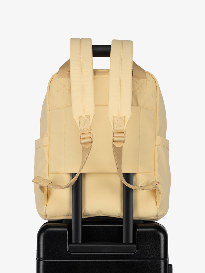 Luggage trolley sleeve of CALPAK Connect Laptop Backpack in sunshine yellow