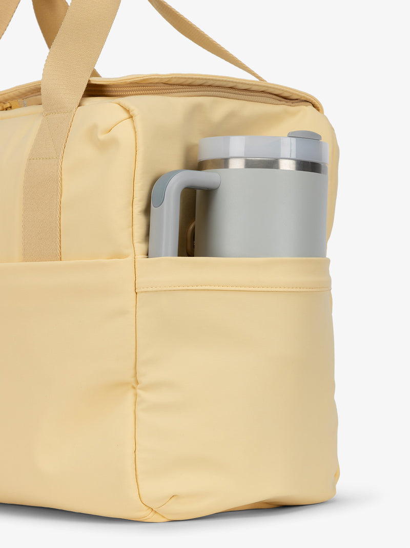 CALPAK Connect laptop duffel with large side water bottle pocket in sunshine