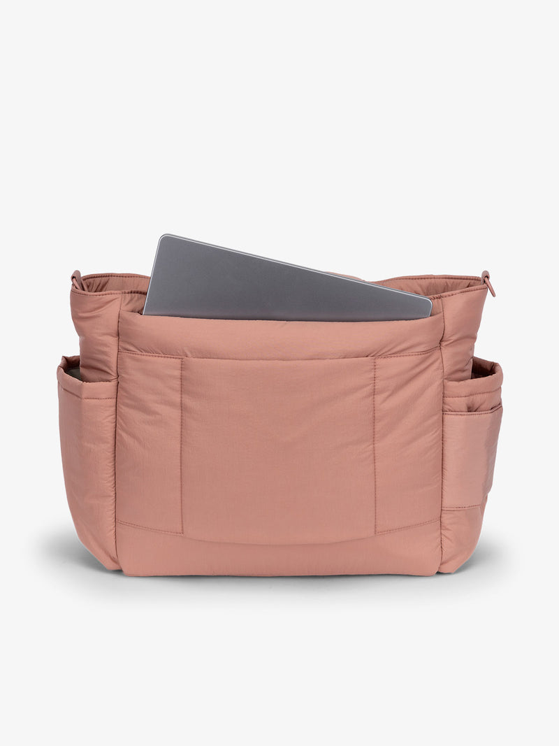 Peony CALPAK laptop diaper tote bag with multiple insulated exterior bottle pockets and a spacious pocket for laptop or ipad