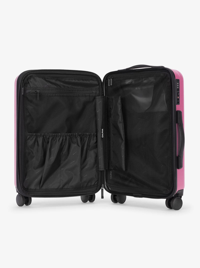 Pinkish red raspberry CALPAK Evry Carry-On Luggage features divided compartments with interior pockets for organized packing