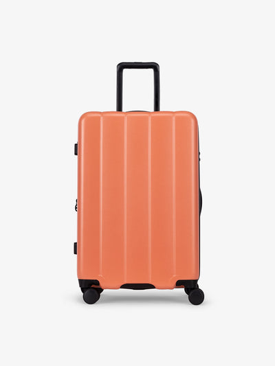 CALPAK Persimmon medium luggage made from an ultra-durable polycarbonate shell and expandable by up to 2; LCO1024-PERSIMMON view 1