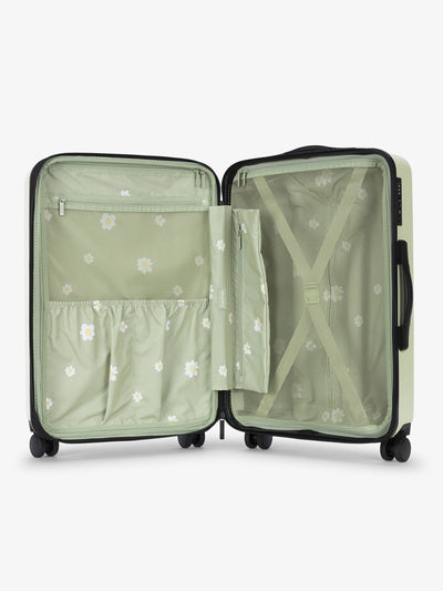 CALPAK Evry Medium Luggage features divided compartments with interior pockets for organized packing in light green daisy floral print