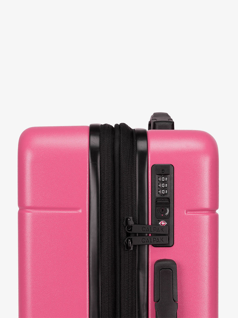 CALPAK Hot pink dragonfruit Hue rolling carry-on suitcase with TSA locks