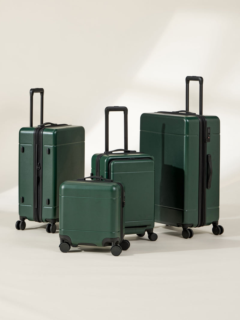 CALPAK Hue Full Luggage Set including Front Pocket Carry On, Mini Carry On, Carry On, and Large Luggage in forest green Emerald