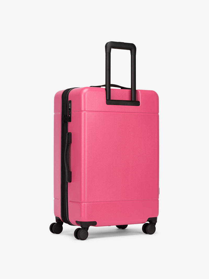 CALPAK Dragonfruit hue rolling medium size polycarbonate suitcase