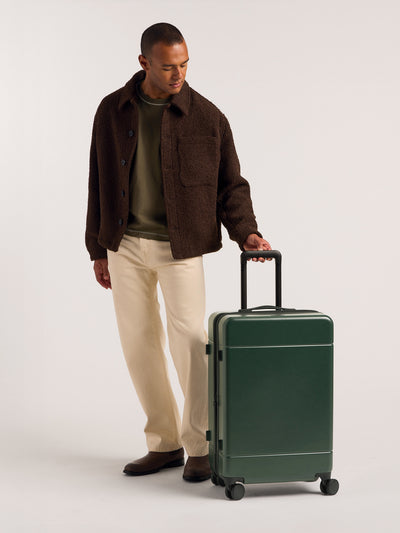 CALPAK Hue Medium 26 inch hardside Luggage front view in green Emerald; LHU1024-EMERALD view 2