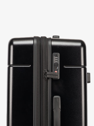 Black CALPAK medium trunk luggage with TSA accepted lock