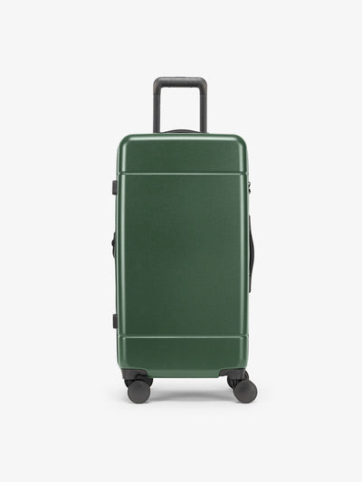 CALPAK Hue Medium Trunk Luggage with durable hard-shell exterior, cushioned top handle and 360 spinner wheels in emerald; LHU1026-EMERALD view 1