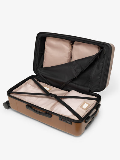 CALPAK Hue medium trunk suitcase with spacious interior and zippered divider with pockets in brown hazel