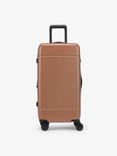 CALPAK Hue Medium Trunk Luggage with durable hard-shell exterior, cushioned top handle and 360 spinner wheels in hazel