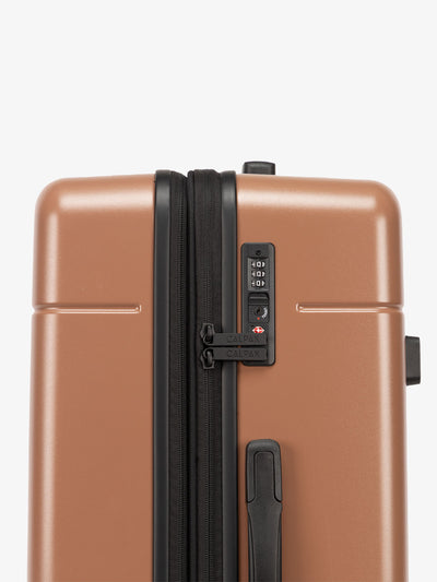 Brown hazel CALPAK medium trunk luggage with TSA accepted lock