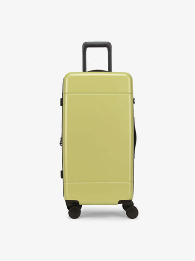 CALPAK Hue Medium Trunk Luggage with durable hard-shell exterior, cushioned top handle and 360 spinner wheels in key lime; LHU1026-KEY-LIME
