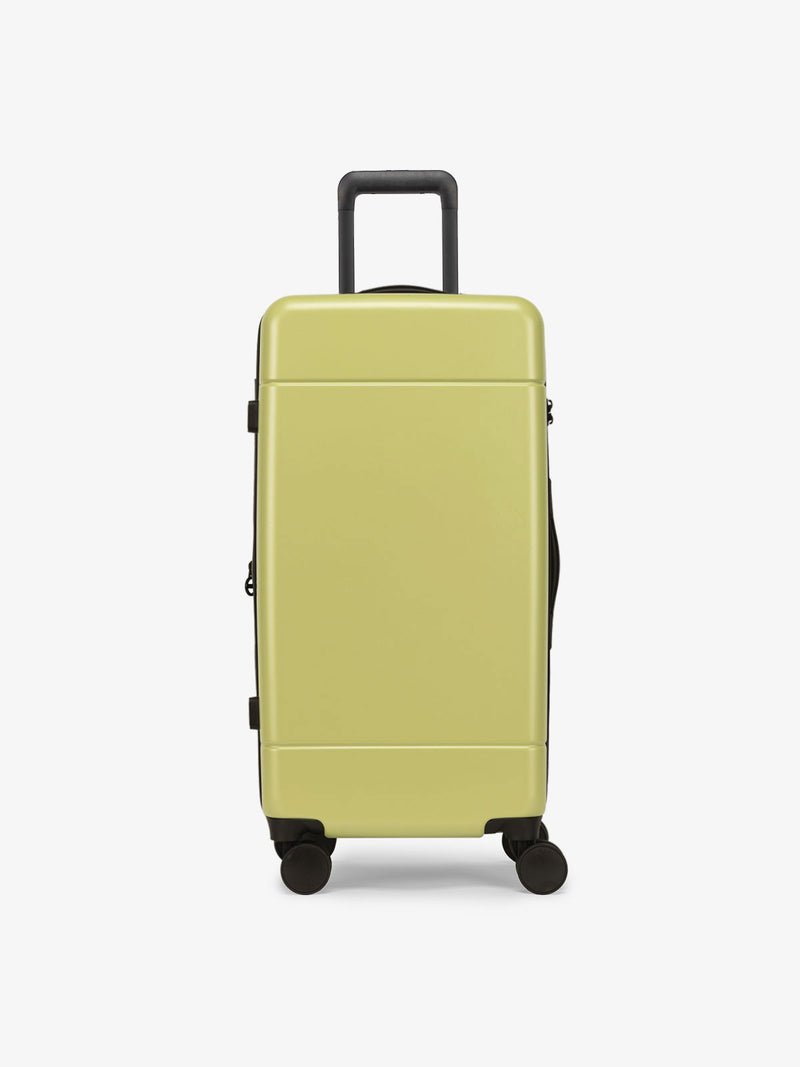 CALPAK Hue Medium Trunk Luggage with durable hard-shell exterior, cushioned top handle and 360 spinner wheels in key lime