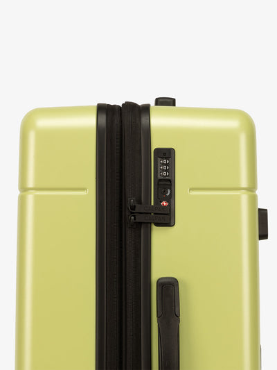 Key lime green CALPAK medium trunk luggage with TSA accepted lock