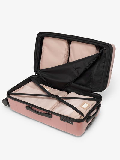 CALPAK Hue medium trunk suitcase with spacious interior and zippered divider with pockets in pink mauve