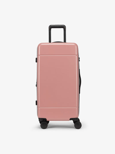 CALPAK Hue Medium Trunk Luggage with durable hard-shell exterior, cushioned top handle and 360 spinner wheels in mauve
