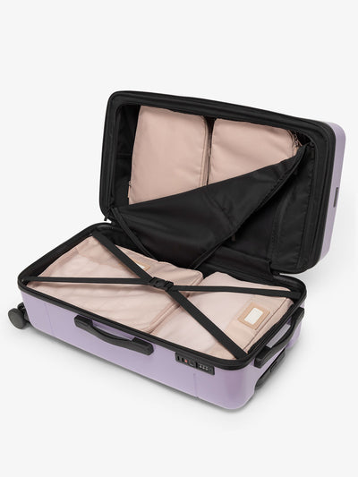CALPAK Hue medium trunk suitcase with spacious interior and zippered divider with pockets in purple orchid