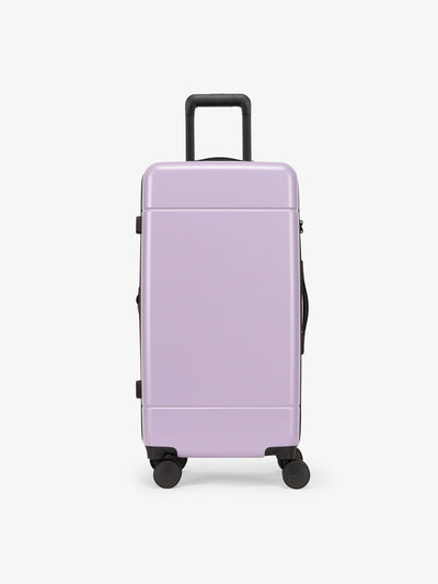 CALPAK Hue Medium Trunk Luggage with durable hard-shell exterior, cushioned top handle and 360 spinner wheels in orchid