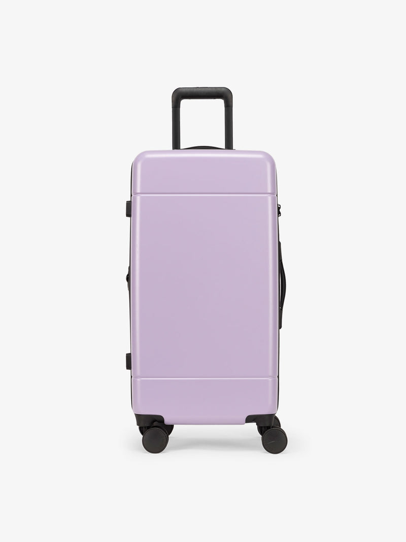 CALPAK Hue Medium Trunk Luggage with durable hard-shell exterior, cushioned top handle and 360 spinner wheels in orchid