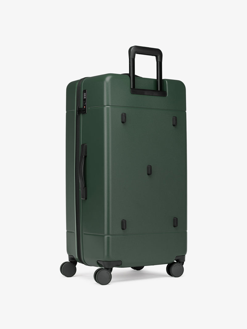 CALPAK Hue hard side polycarbonate Trunk Luggage back view in dark green emerald