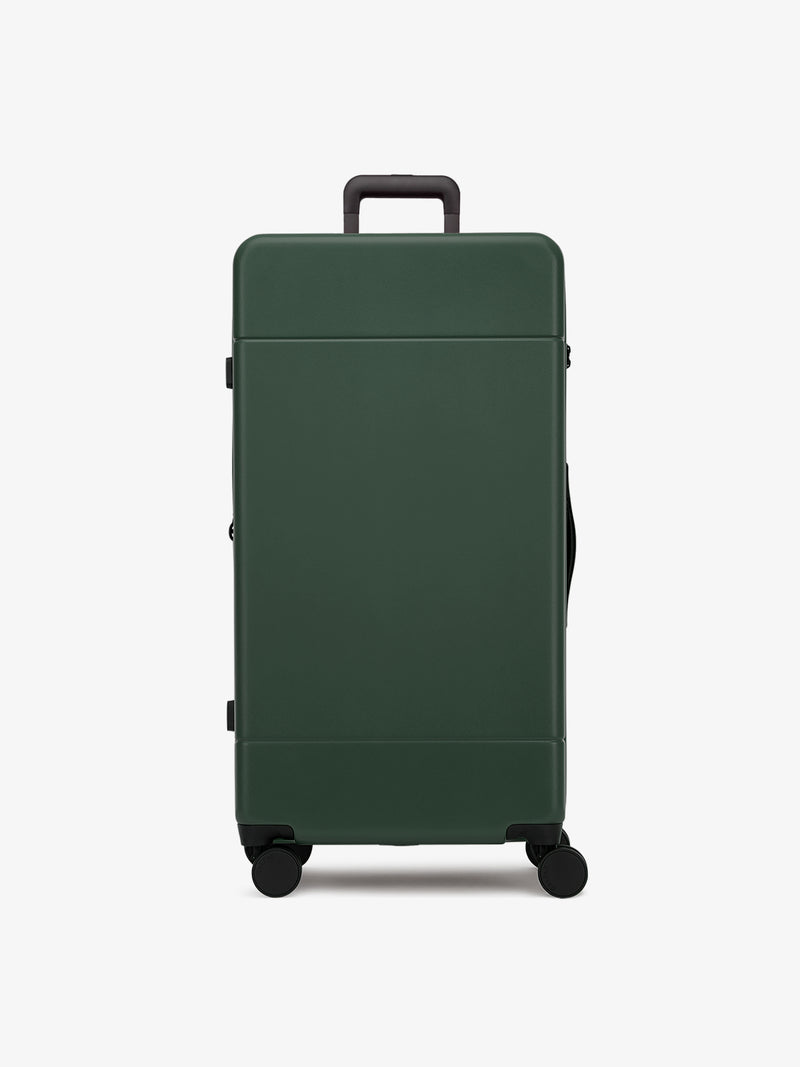 CALPAK Hue hard side polycarbonate Trunk Luggage front view in dark green emerald