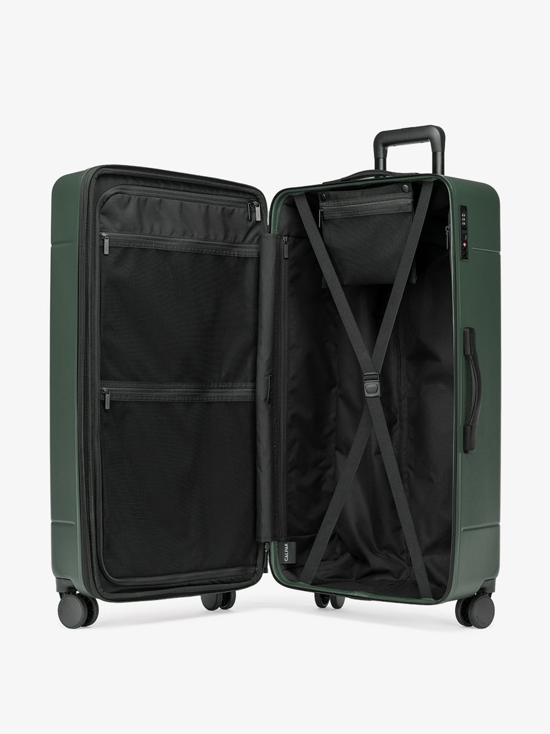 CALPAK Hue hard side polycarbonate Trunk Luggage opened interior in dark green emerald