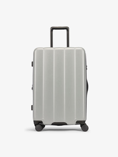 CALPAK Smoke gray medium luggage made from an ultra-durable polycarbonate shell and expandable by up to 2; LCO1024-SMOKE view 1