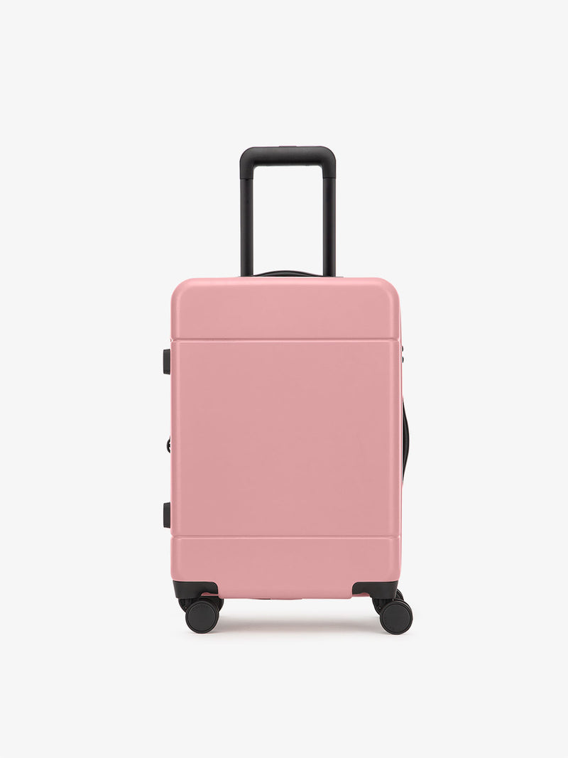 CALPAK Hue hard shell rolling carry on luggage in light pink mauve