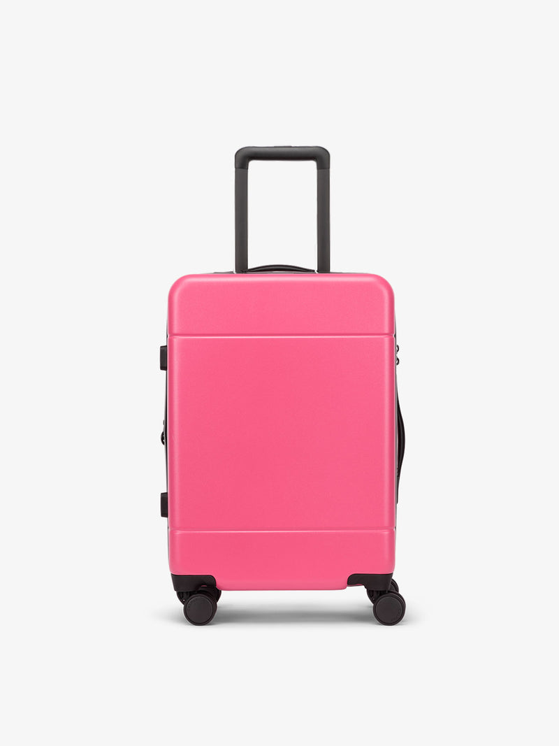 CALPAK Hue hard shell rolling carry on luggage in hot pink dragonfruit