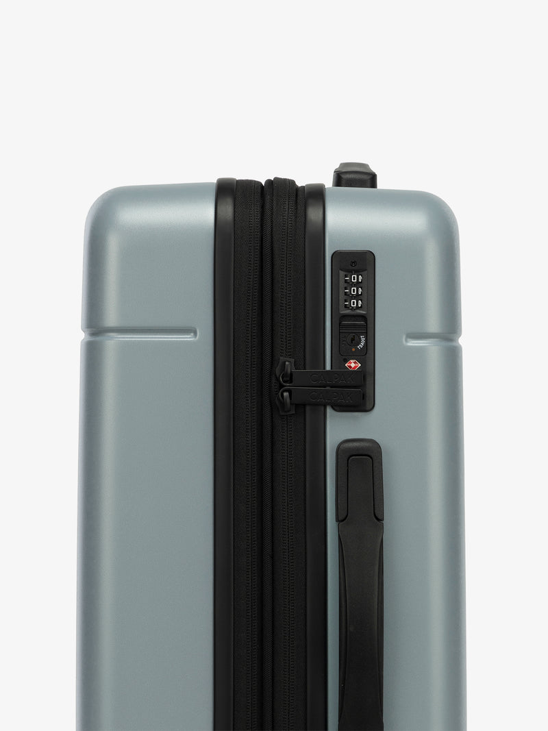 CALPAK Hue Medium Luggage in blue Bluebell side view with TSA-friendly lock