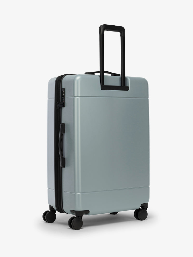 Back view of CALPAK Hue Large Luggage in blue Bluebell