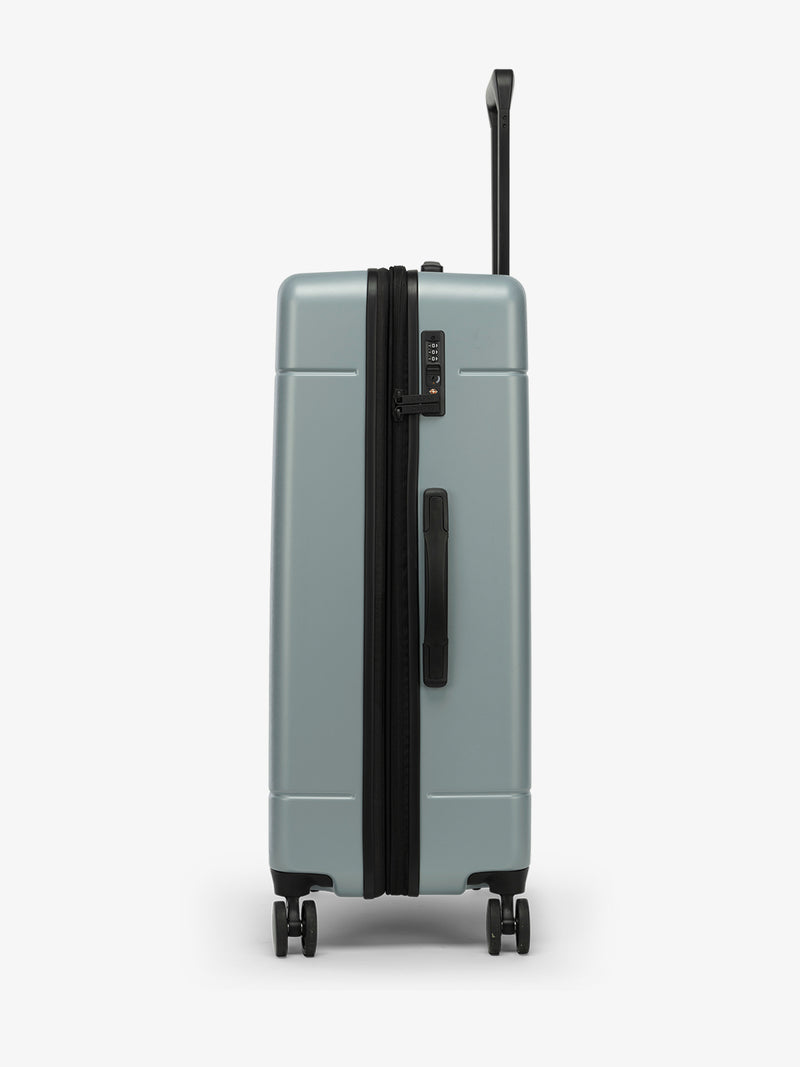 Side view of CALPAK Hue Large Luggage in blue Bluebell