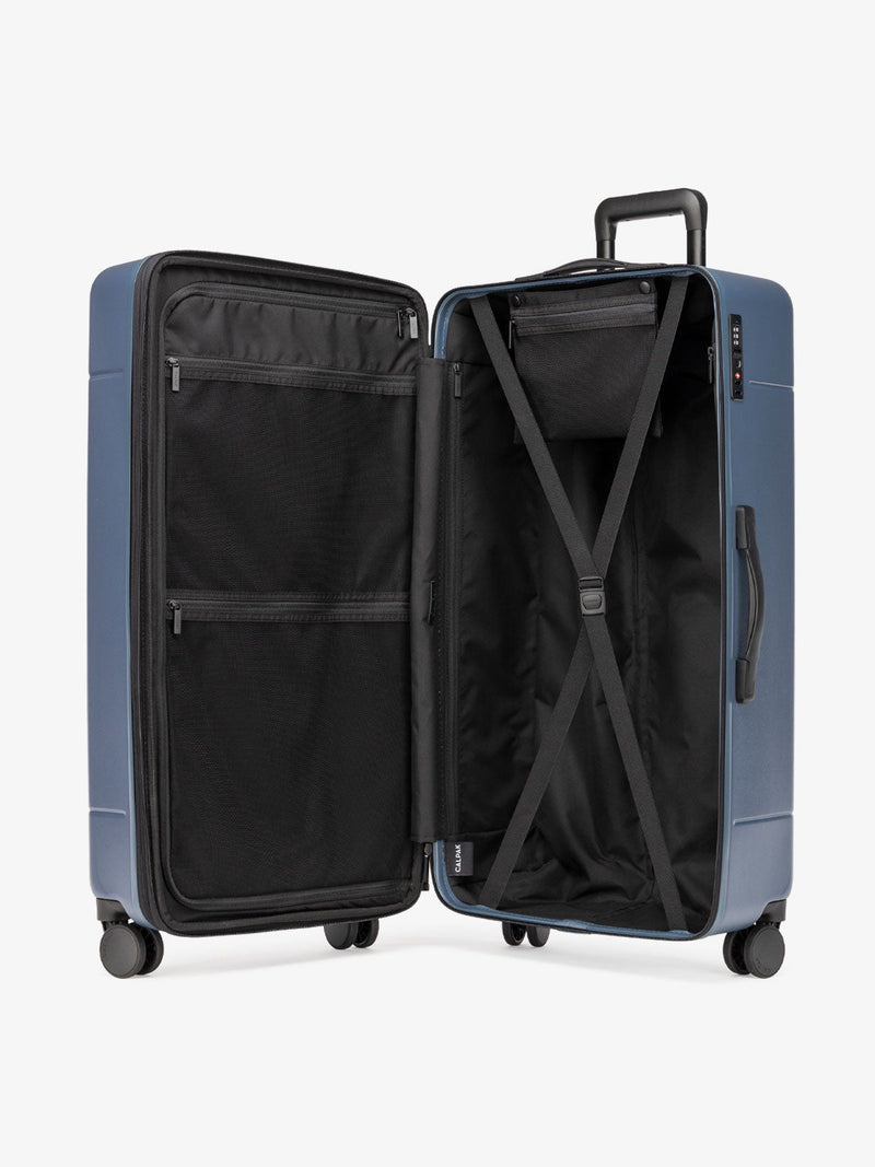 CALPAK interior of Hue 31 inch hard side polycarbonate trunk luggage in atlantic blue