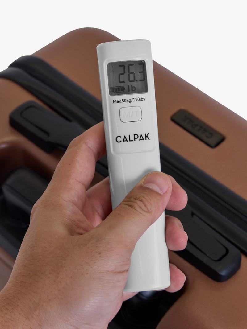 CALPAK Battery-Free Luggage Scale weighing both pounds or kilogram units