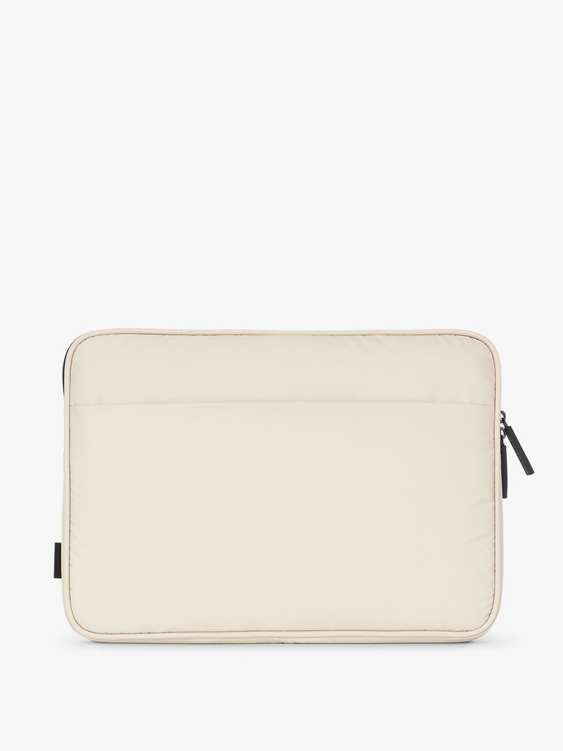 Back view of CALPAK Luka 14" Padded Laptop Sleeve with multiple exterior pockets in beige